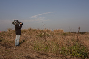 January 13, 2014 – Villa di Briano, Italy: A cameraman records a field that, according to repent of Camorra, was used as a toxic waste dump near Caserta.