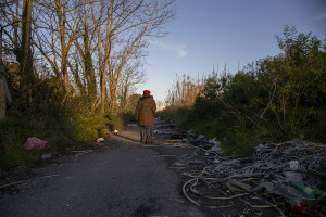 January 28, 2014 – Giugliano, Italy: The activist Lucia De Cicco walks in the so-called area Vasto, full of toxic waste underground and illegal dumps close to the farmlands. Lucia, during a protest of 2008 against the re-opening of the storage site Taverna del Re, set herself on fire.