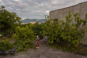 May 23, 2015 – Terzigno, Italy: A statue of Padre Pio near a house located a few hundred meters from the Ranieri quarry. Ranieri quarry is an area of extraction of lava material disposed on June 5, 1995 with the establishment of the Vesuvius National Park. The landfill, which lies entirely in the Vesuvius National Park, despite the environmental constraints, in 2000 was used as a landfill with a promise to be “cleaned up” within a year. Due to the loss of volume and the collapse of the waterproof membrane that covered the landfill at the quarry, it has turned into a lake of rainwater unhealthy where floating waste of all kinds.