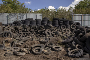 October 7, 2013 – Scisciano, Italy: Hundreds of wheels piled in the so-called cemetery of tires.