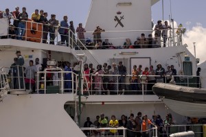Migrants wait to disembark from the Spanish Guardia Civil Rio Segura Patrol Ship with 1216 migrants onboard including 256 children and 11 pregnant women, who were rescued in the Mediterranean sea in Salerno, Southern Italy on June 29, 2017.