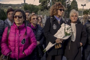 Italian citizens take part in funerals of 26 teenage migrant women found dead in the Mediterranean sea in early November, during the inter religious funeral service at the cemetery of Salerno, southern Italy on November 17, 2017. The bodies of the victims were found floating in the water by Cantabria Spanish ship last November 5.