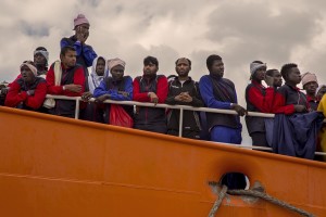 Migrants wait to disembark from the Aquarius rescue ship run by NGO S.O.S. Mediterranee and Medecins Sans Frontieres at Salerno harbour on May 26 2017. More than 1000 migrants including 240 children disembark from the Aquarius today.