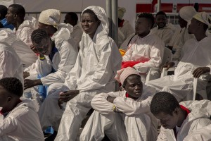 SALERNO, ITALY – MAY 26: Migrants affected by scabies are seen at Manfredi pier of Salerno port after the arrival of the Aquarius rescue ship run by NGO S.O.S. Mediterranee and Medecins Sans Frontieres on May 26 2017. More than 1000 migrants including 240 children disembark from the Aquarius today.