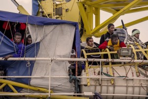 SALERNO, ITALY – MAY 26: Migrants wait to disembark from the Aquarius rescue ship run by NGO S.O.S. Mediterranee and Medecins Sans Frontieres at Salerno harbour on May 26 2017. More than 1000 migrants including 240 children disembark from the Aquarius today.