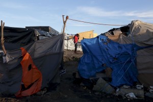 January 28, 2016 – Calais, France: A migrant is seen inside the refugee camp of Calais, known as “The Jungle”. While migrants have for years sought to cross over to Britain from Calais, the numbers have shot up since the refugee crisis went into overdrive last year.