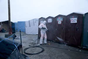 January 27, 2016 – Calais, France: Cleaning inside the migrants camp of Calais, known as “The Jungle”. While migrants have for years sought to cross over to Britain from Calais, the numbers have shot up since the refugee crisis went into overdrive last year.