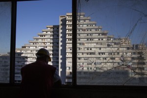 A man at work during the transfer of a family from an apartment inside the “Vele” of Scampia to a new accommodation realized always in Scampia, in Naples on November 10, 2016. The “vele” of Scampia, become famous for the long and bloody Camorra feuds, will be demolished starting from spring 2017.