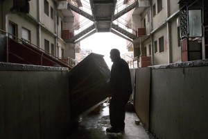 A man is seen during the transfer from an apartment inside the “Vele” of Scampia to a new accommodation realized always in Scampia, in Naples on November 11, 2016. The “vele” of Scampia, become famous for the long and bloody Camorra feuds, will be demolished starting from spring 2017.