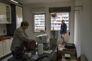A woman is seen in her apartment inside the “vele” of Scampia, before leaving it definitely and entering into one of the new accommodations realized always in Scampia, in Naples on November 11, 2016. The “vele” of Scampia, become famous for the long and bloody Camorra feuds, will be demolished starting from spring 2017.