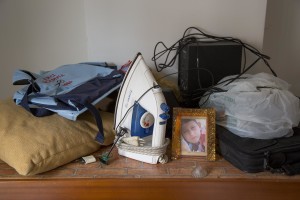 An iron and other objects are seen in a room after the transfer of a family from their old house in one of the “vele” of Scampia to a new accomodation, in Naples on November 25, 2016. The “vele” of Scampia, become famous for the long and bloody Camorra feuds, will be demolished starting from spring 2017.