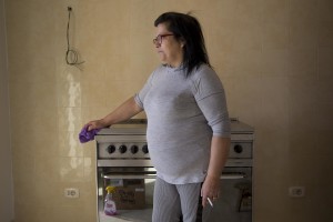 Carmela Mele is seen in her new accomodation after the transfer from the “vele” of Scampia, in Naples on November 28, 2016. The “vele” of Scampia, become famous for the long and bloody Camorra feuds, will be demolished starting from spring 2017.