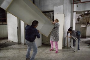 People are seen during the transfer from an apartment inside the “Vele” of Scampia to a new accommodations realized always in Scampia, in Naples on November 11, 2016. The “vele” of Scampia, become famous for the long and bloody Camorra feuds, will be demolished starting from spring 2017.