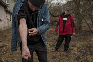 Tarmo, 33 years old and Mart, 35 years old inject a dose of fentanyl inside a park of Majaka, in Tallinn, Estonia on March 19, 2017. Majaka is considered to be among the neighborhoods with the higest number of fentanyl addicts in the city.