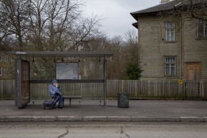 A woman waits for the bus sitting on a bench of a bus stop in Kopli, a suburb of Tallinn, Estonia on March 18, 2017. Kopli is considered one of the neighborhoods with the higest number of fentanyl addicts in the city.