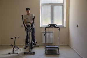 Ali Hassan from Pakistan plays gymnastics inside the headquarter of Chianche Sprar (Protection systems for asylum seekers and refugees) near Petruro Irpino, southern Italy on June 14, 2017. Petruro Irpino is an Italian small village with 367 inhabitants in the province of Avellino in Campania, which is claiming to be an efficient model of integration and where people of different religions and coming from different parts in the world peaceful live together.