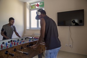 Yaya Darboo from Gambia and Abdirahman Mamud from Somalia play table football inside the headquarter of Chianche Sprar (Protection systems for asylum seekers and refugees) near Petruro Irpino, southern Italy on June 14, 2017. Petruro Irpino is an Italian small village with 367 inhabitants in the province of Avellino in Campania, which is claiming to be an efficient model of integration and where people of different religions and coming from different parts in the world peaceful live together.
