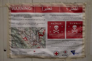 A map showing the dangerous areas contaminated by mines and other unexploded ordnance is attached on a wall of an abandoned building where migrants take refuge in the outskirts of the Bosnian city of Bihać, Bosnia and Herzegovina on November 29, 2018.
