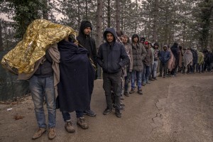 Afghans and Pakistanis migrants lined up during the food distribution near a park in Bihać, Bosnia and Herzegovina on November 28, 2018.