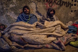 Migrants rest inside an abandoned building where they took refuge in the outskirts of the Bosnian city of Bihać, Bosnia and Herzegovina on November 28, 2018.