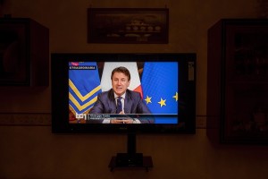 A television tuned on Rai1 during the speech of Italian Prime Minister Giuseppe Conte to announce the closure of all unnecessary production activities to slow the spread of coronavirus in the country in Naples, Italy on March 21, 2020.