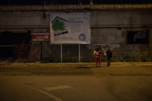 A volunteer from the Italian Red Cross distributes a meal to a homeless person in Naples, Italy on April 2, 2020. Homeless are experiencing a double emergency: the first one due to their condition, the second one linked to the spread of the coronavirus that caused the closure of many assistance centers because of possible contagion.