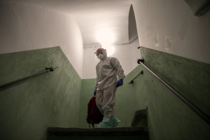 A nurse of the Italian Red Cross is seen after a night intervention at a person’s home who suspected to have coronavirus symptoms in Naples, Italy on April 7, 2020.