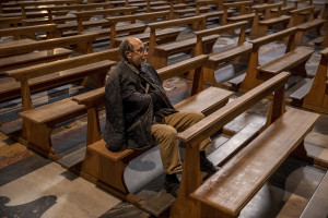 A man prays inside the empty “Gesù Nuovo” church on the third day of unprecedented lockdown across of all Italy imposed to slow the spread of coronavirus in Naples, Southern Italy on March 12, 2020.