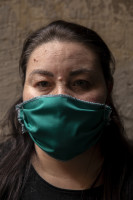 Antonella, 38 years old is portrayed wearing a mask on the eighth day of unprecedented lockdown across of all Italy imposed to slow the spread of coronavirus in Naples, Southern Italy on March 17, 2020.