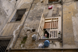 A woman on the balcony  on the eighth day of unprecedented lockdown across of all Italy imposed to slow the spread of coronavirus in Naples, Southern Italy on March 17, 2020.