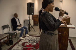 Princess Inyang Okokon (right) celebrates the Sunday mass inside a Pentecostal church in Asti, Northern Italy on January 12, 2020. Princess illegally entered Italy in 1998 as a victim of human trafficking. When she met her future husband Alberto Mossino she was able to pay off her debt of 45000 euros with the madame and interrupt that kind of life. In 2000, together with Alberto, she decided to found the non-profit organization Piam (migrant reception integration project) to help foreign girls victims of human trafficking.