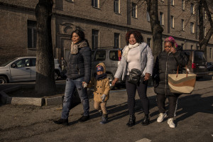 Princess Inyang Okokon (left) and some of her collaborators accompany the son of one of the girls hosted by the Piam non-profit organization to school in Asti, Northern Italy on January 9, 2020.