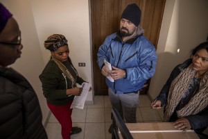 A bellhop delivers food to the headquarters of the Piam non-profit organization in Asti, Northern Italy on January 9, 2020.