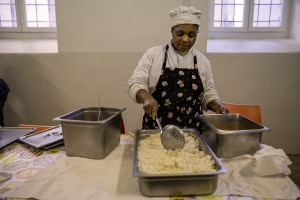 Destiny prepares food for the girls hosted by the non-profit organization Piam in Asti, Northern Italy on January 10, 2020.