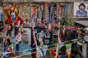 Posters and murals depicting the Argentine soccer legend Diego Armando Maradona are seen in the Spanish Quarter in Naples, Southern Italy on November 23, 2021. Diego Armando Maradona died on November 25 of last year and next November 25, 2021 will be the anniversary of his death.