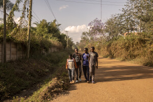 Dance Centre Kenya student Bravian Mise, 14 years old (second on the left) walks with his friends along a street of the Kuwinda slum in Nairobi, Kenya on October 10, 2024. The main purposes of Dance Centre Kenya is to provide international training for talented young dancers, regardless of their background or nationality. It also represents a bridge between Africa and foreign countries, giving dozens of less fortunate children the chance to dream of a better future.