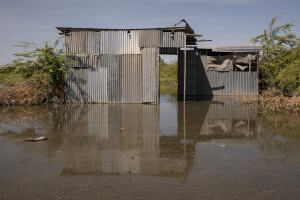 A shop partially submerged by the waters of Turkana Lake, northwest Kenya on October 15, 2024. The water level of Lake Turkana is rising rapidly. This complex phenomenon is linked to climate change, with rare but abundant and violent rainfall, but also to underground springs and movements of tectonic plates that influence water flows, contributing to the rise in water levels.