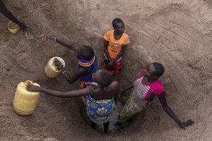 Women fetche water from the dried Kalotumum River in Kerio, located in Turkana County, northwest Kenya on October 17, 2024. Due to the severe drought that is affecting the country, many people are forced to drink water that they fetch from the underground, which is not clean and often causes infections or diseases. According a 2023 UN Water Development Report, groundwater levels are falling, forcing some communities to drill wells twice as deep as they were a decade ago.