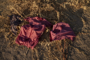 School uniforms hung out to dry on the bank of the dried Kawalasee River in Lodwar, northwest Kenya on October 19, 2024. Kenya’s rivers are drying up rapidly, with low rainfall and global warming being among the main causes of this phenomenon.