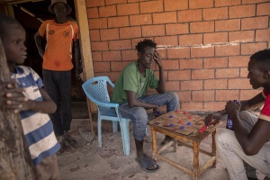 Two boys play checkers in Kapua village, located in Turkana County, northwest Kenya on October 17, 2024. Kapua is one of the villages most affected by the severe drought in Kenya, that is generating food insecurity and difficult access to water. Many people are forced to drink water that they fetch from the underground, which is not clean and often causes infections or diseases.