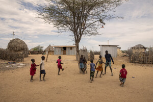 Children play football in Kapua village, located in Turkana County, northwest Kenya on October 17, 2024. Kapua is one of the villages most affected by the severe drought in Kenya, that is generating food insecurity and difficult access to water. Many people are forced to drink water that they fetch from the underground, which is not clean and often causes infections or diseases.