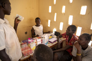 Women receiving medicine from a doctor at the Kalokol Gok Health Centre, located in Turkana County, northwest Kenya on October 16, 2024. The Kalokol Gok Health Centr welcomes women and children from the surrounding villages to provide them with medicines, food supplements and to monitor their health conditions, which are put at risk by the severe drought that is affecting the country.