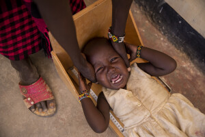 A malnourished little girl cries as a doctor measures her height at the Chok Chok dispensary, located in Turkana County, northwest Kenya on October 14, 2024. The Chok Chok dispensary was founded in 2016 by the Turkana Country Government and thanks to the “Nutrition Program” once a week it welcomes women and children from the surrounding villages to provide them with medicines, food supplements and to monitor their health conditions, which are put at risk by the severe drought that is affecting the country.