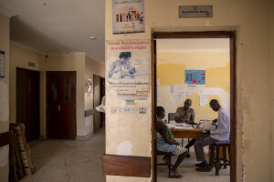 A pregnant woman (left) speaks with a doctor (center) and a community health promoter (right) inside the examination room of the Kangatosa Health Centre located in Turkana County, northwest Kenya on October 19, 2024. Kangatosa Health Centre welcomes women and children from the surrounding villages to provide them with medicines, food supplements and to monitor their health conditions, which are put at risk by the severe drought that is affecting the country.