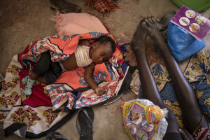 A malnourished child sleeps on the floor of the Chok Chok dispensary, located in Turkana County, northwest Kenya on October 14, 2024. The Chok Chok dispensary was founded in 2016 by the Turkana Country Government and thanks to the “Nutrition Program” once a week it welcomes women and children from the surrounding villages to provide them with medicines, food supplements and to monitor their health conditions, which are put at risk by the severe drought that is affecting the country.