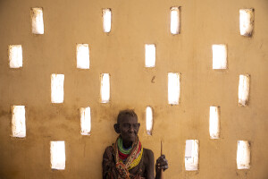 A woman waits her turn at the Kalokol Gok Health Centre, located in Turkana County, northwest Kenya on October 16, 2024. The Kalokol Gok Health Centr welcomes women and children from the surrounding villages to provide them with medicines, food supplements and to monitor their health conditions, which are put at risk by the severe drought that is affecting the country.